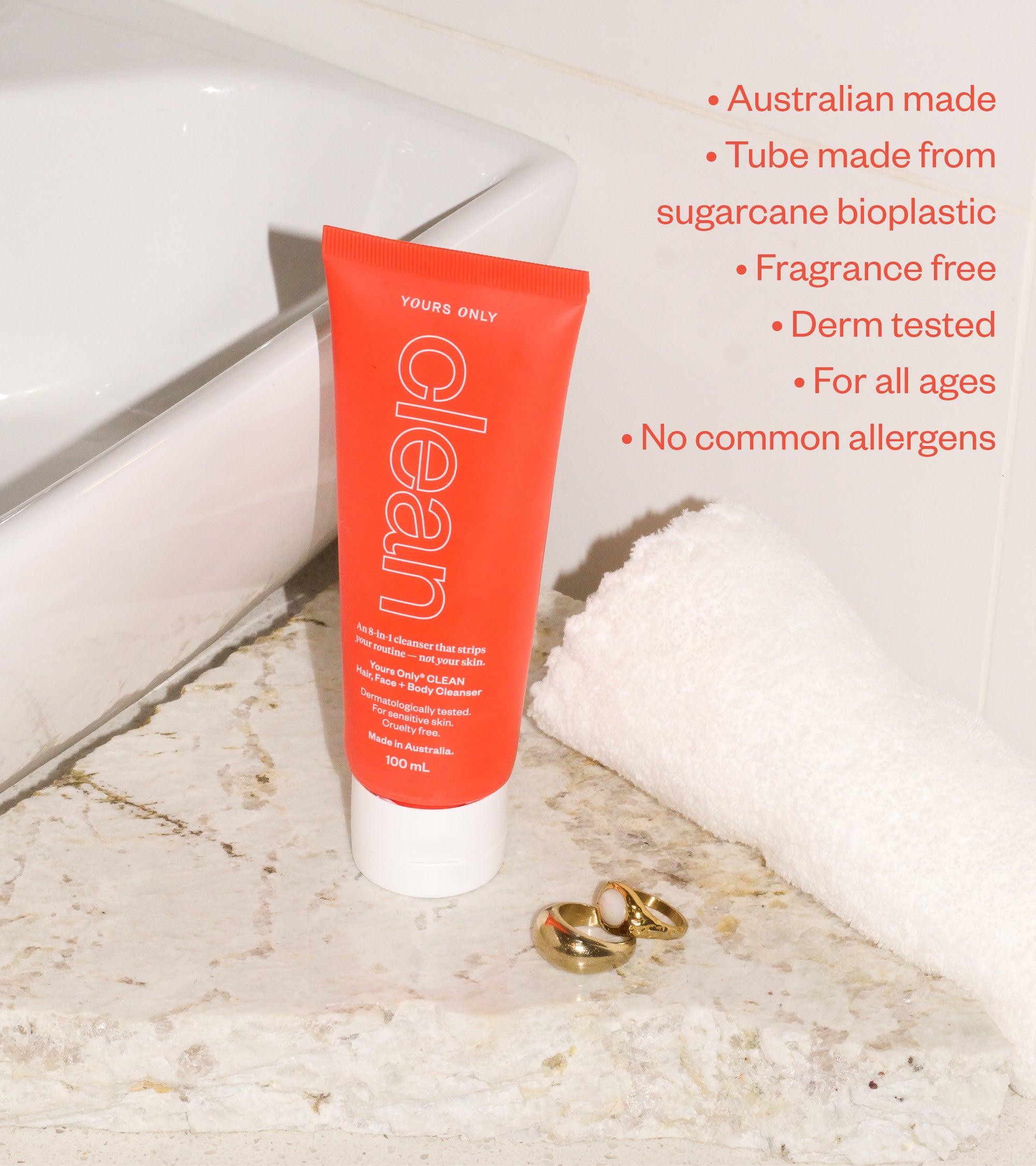 Red tube of 'Your Skin Only' cleanser on a marble surface with product details.