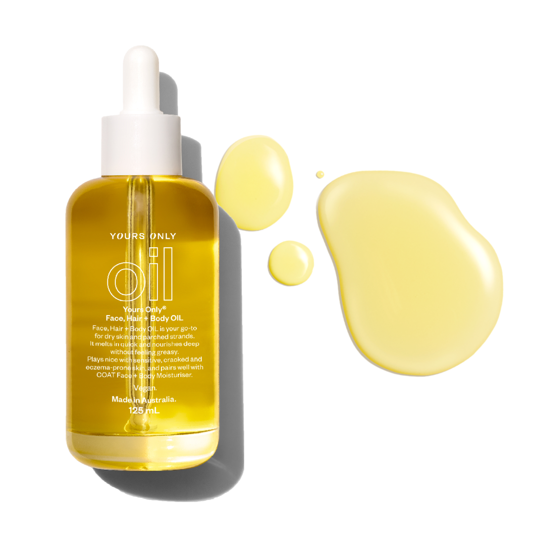 Yours Only Face, Hair + Body Oil 125ml bottle with oil drops on a white background