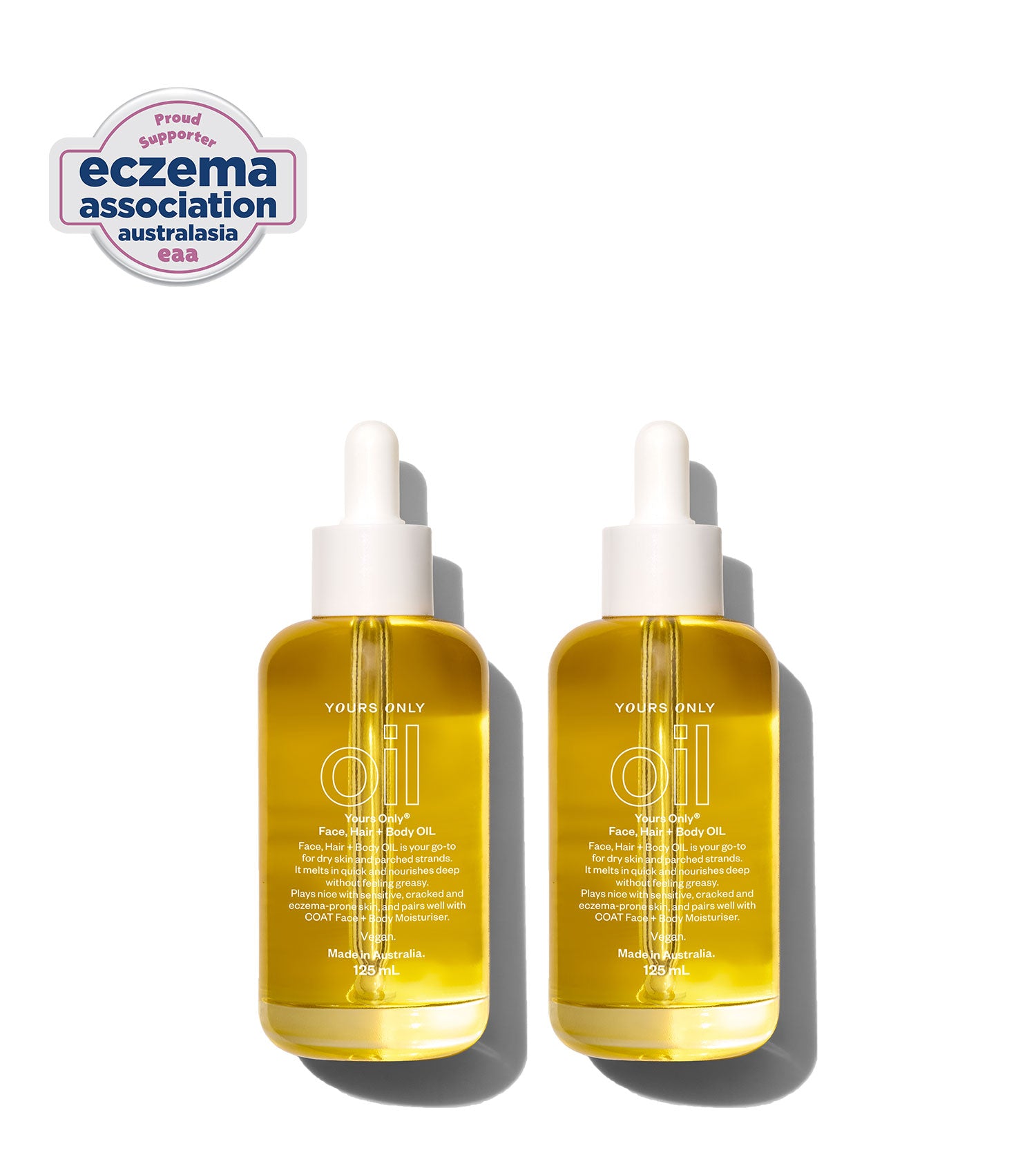 Two 125mL bottles of Yours Only Oil, with a logo for Eczema Association Australasia