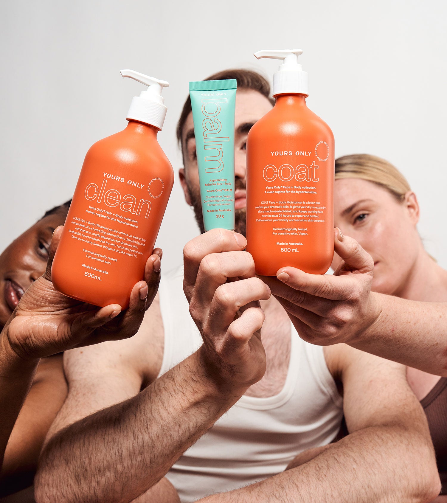 Pre-order starter bundle with three people holding Yours Only Clean, Coat, and Balm products