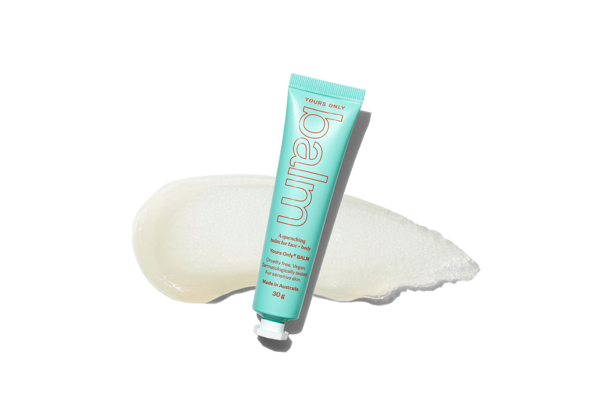 Yours Only Balm tube on a white background with a swatch of the product