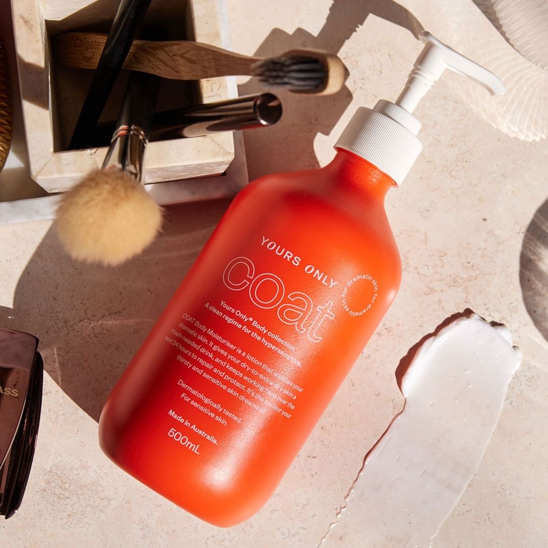 Coral COAT Moisturiser bottle with make up brushes