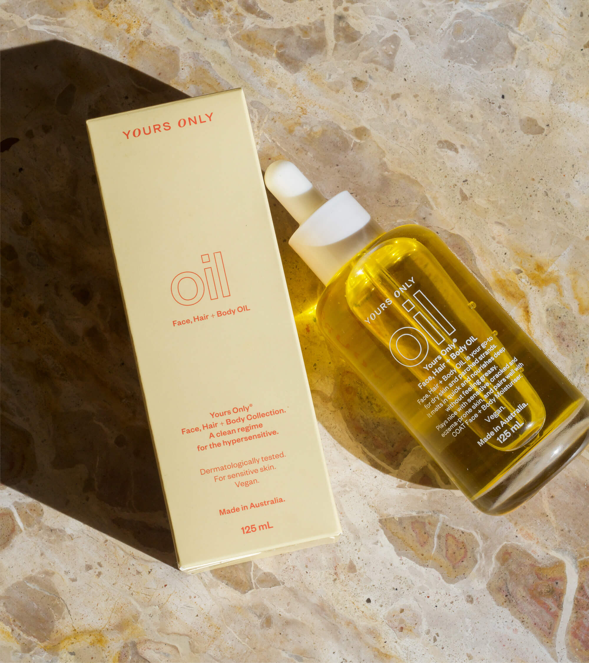 2 x OIL 125mL bottles on a marble surface