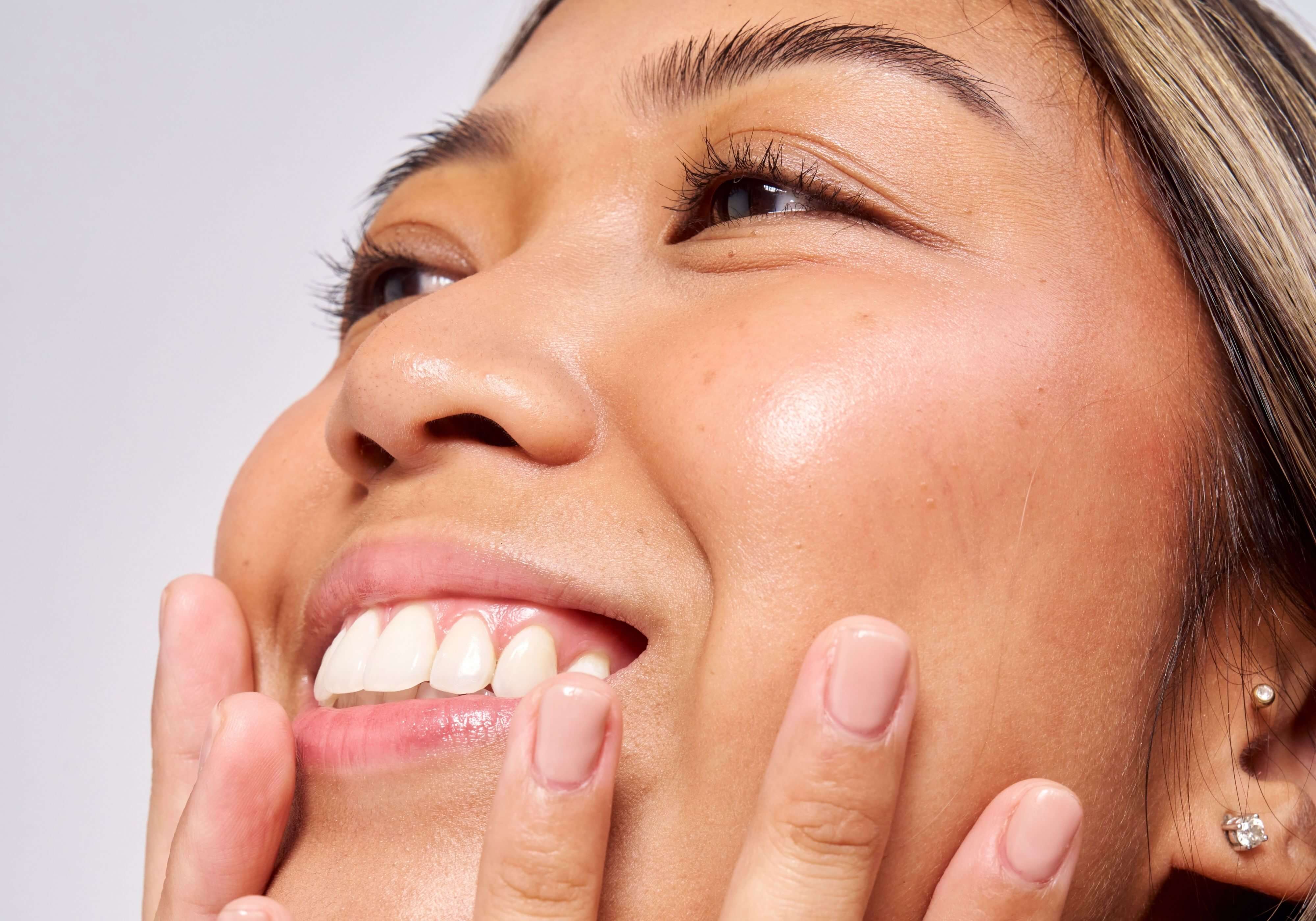 Close-up of a woman's face with a neutral background